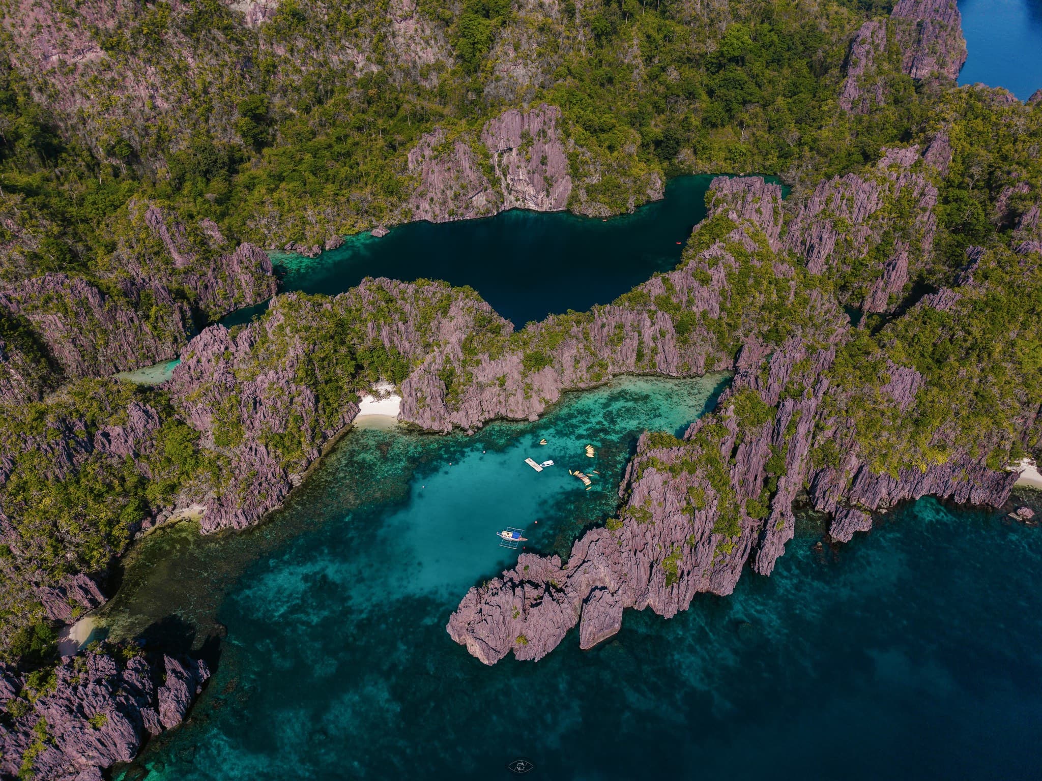 Aerial drone photo of a private boat in an El Nido lagoon
